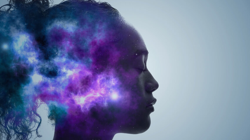 A silhouette of a woman practicing mindfulness